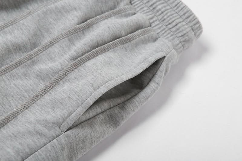 Close-up of gray sweatpants side pocket detail