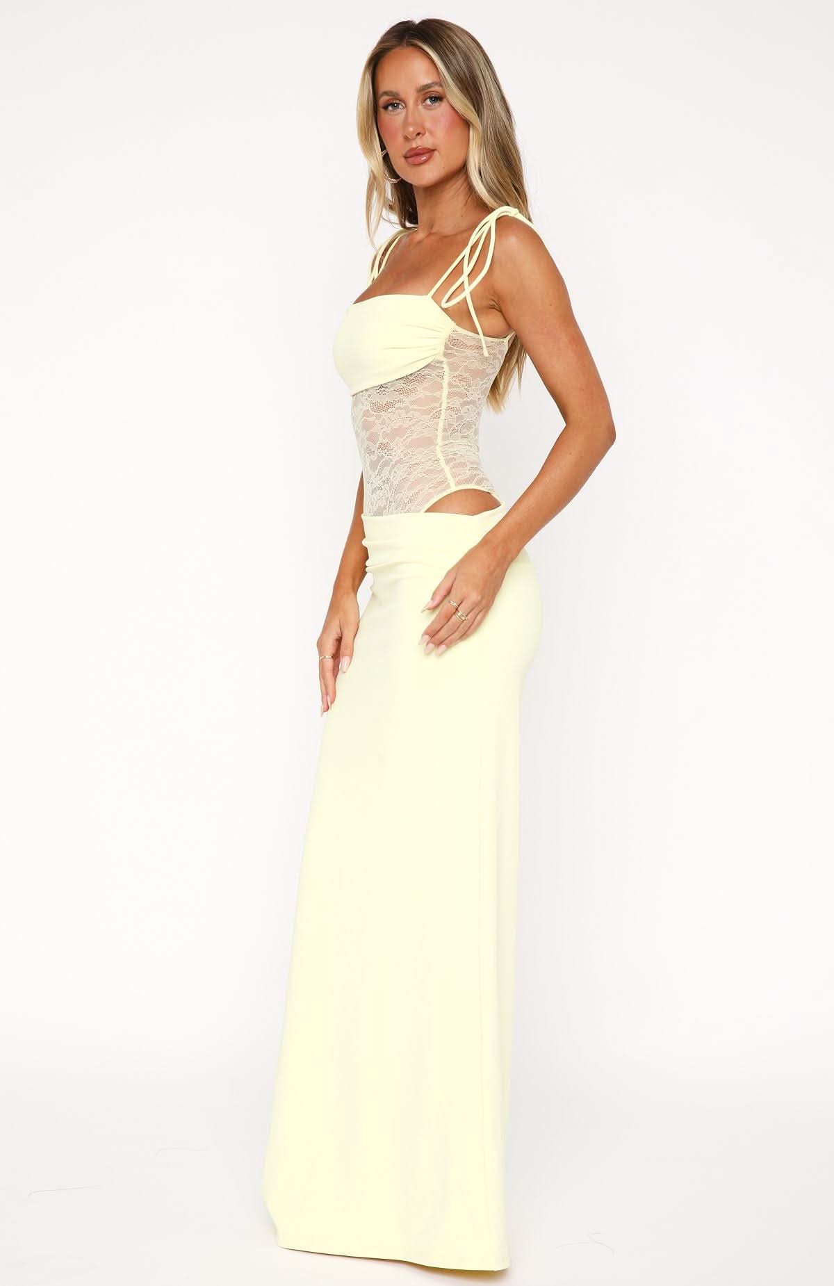 Side view of cream evening gown with lace corset detail and cutout