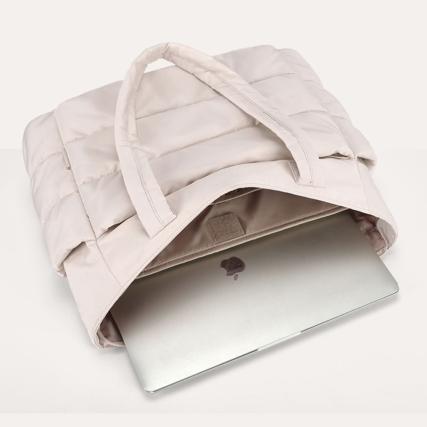 Cream padded tote with open top compartment 15.6 inch laptop inside