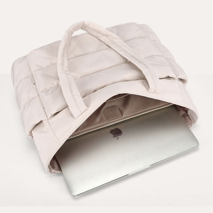 Cream padded tote with open top compartment 15.6 inch laptop inside