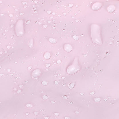 Water droplets beading on pink quilted tote fabric surface