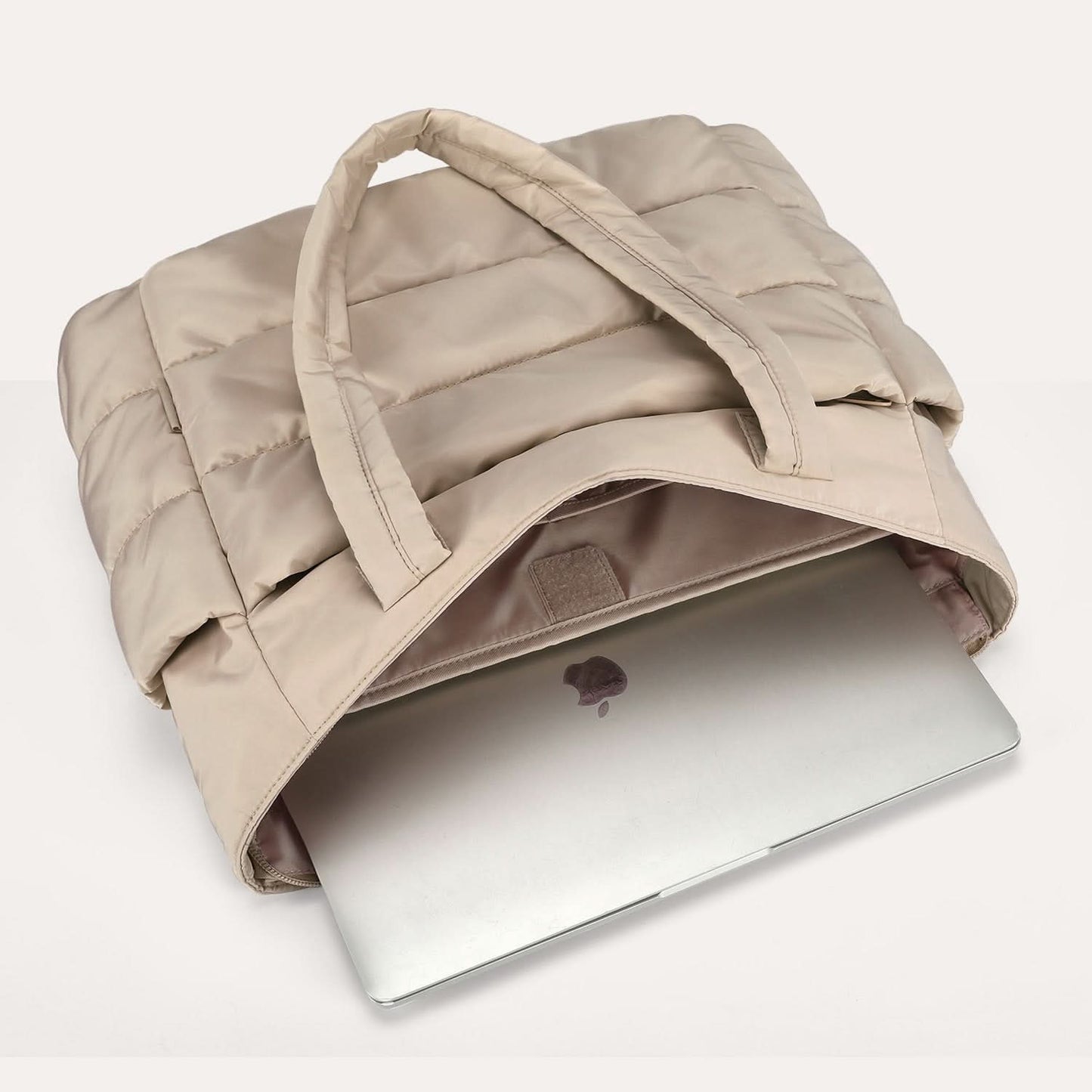 Beige padded laptop tote with 15.6 inch compartment and laptop inside