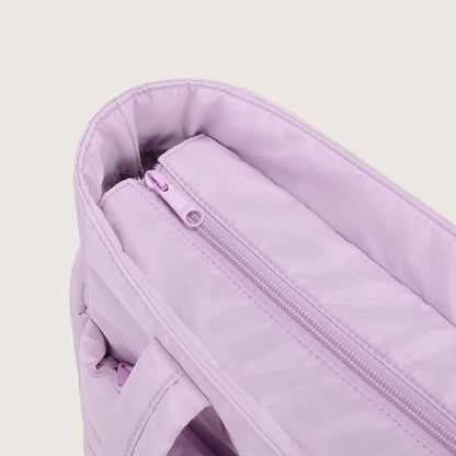 Lavender city tote interior showing main zip pocket and slip pocket organization