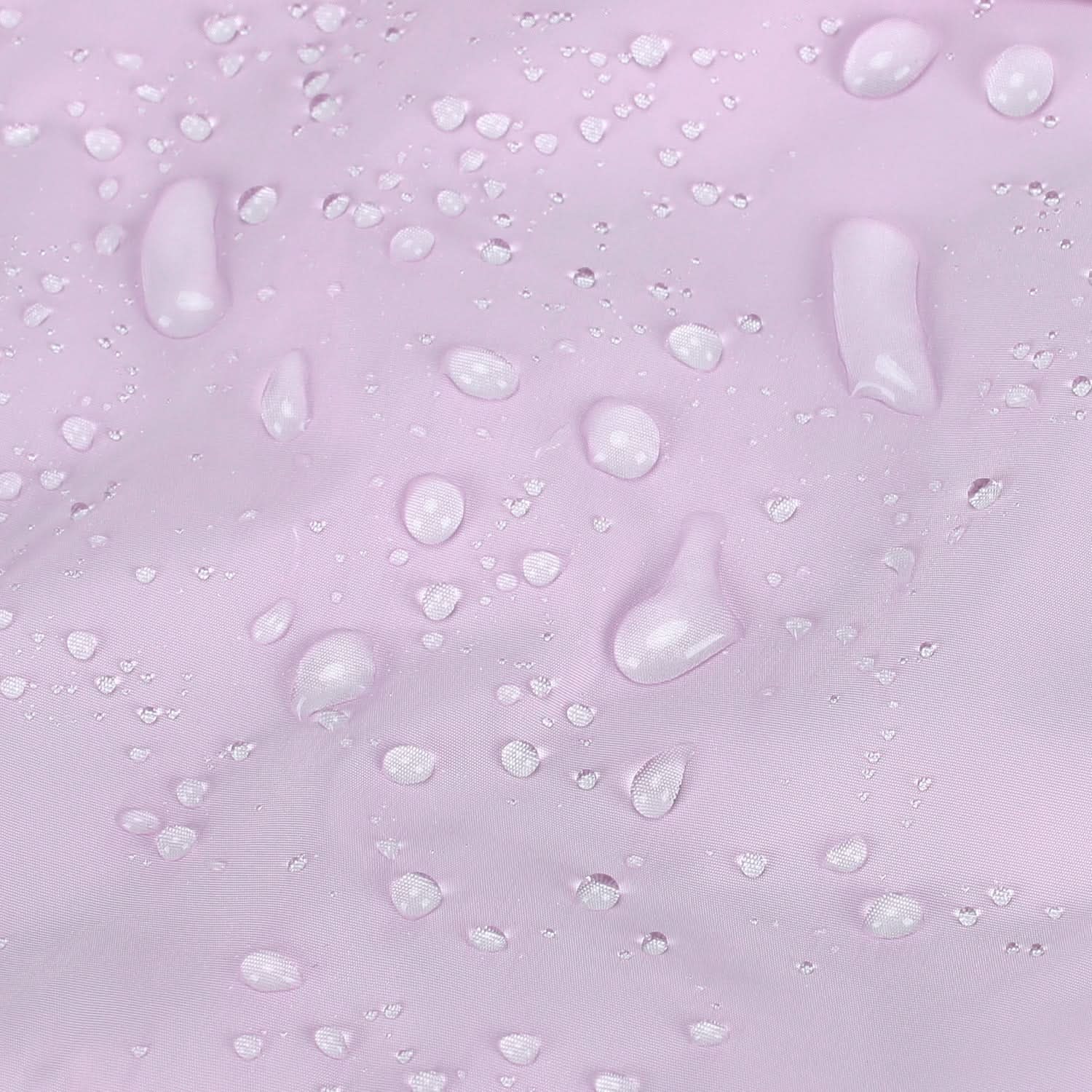 Light gray water-resistant fabric with beading water droplets on surface