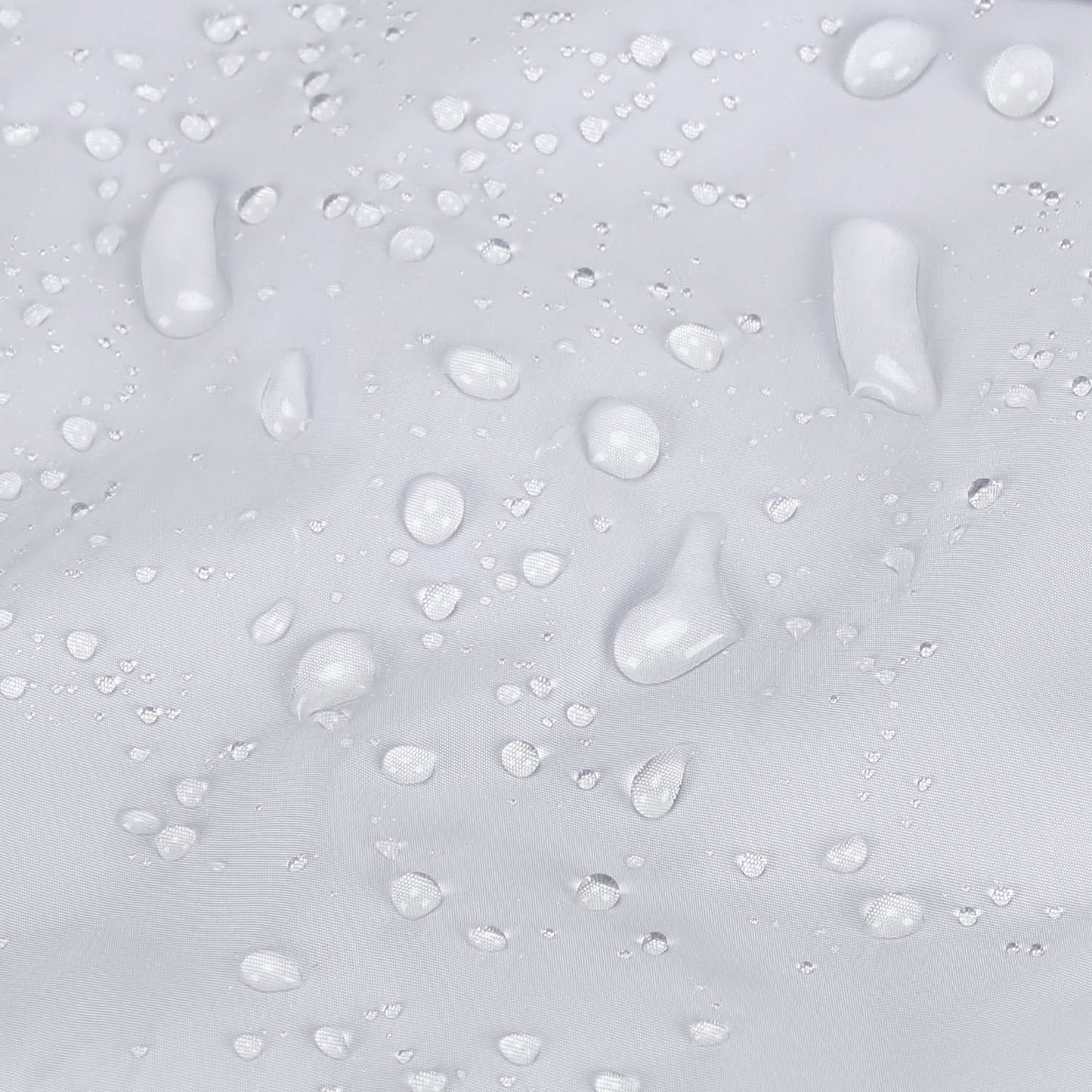 Light gray quilted fabric with water droplets showing water-resistant finish