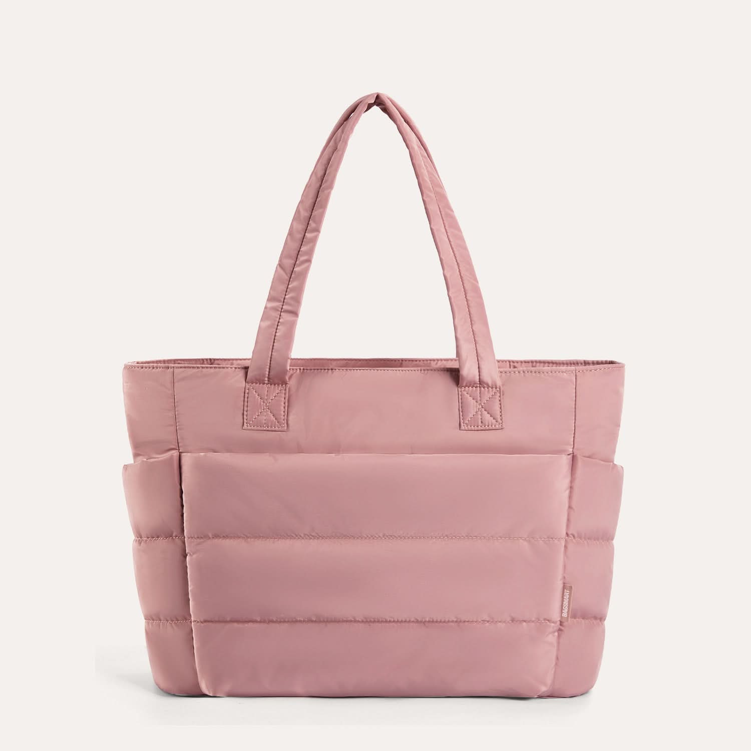Rose pink quilted laptop tote with horizontal stitching and dual handles