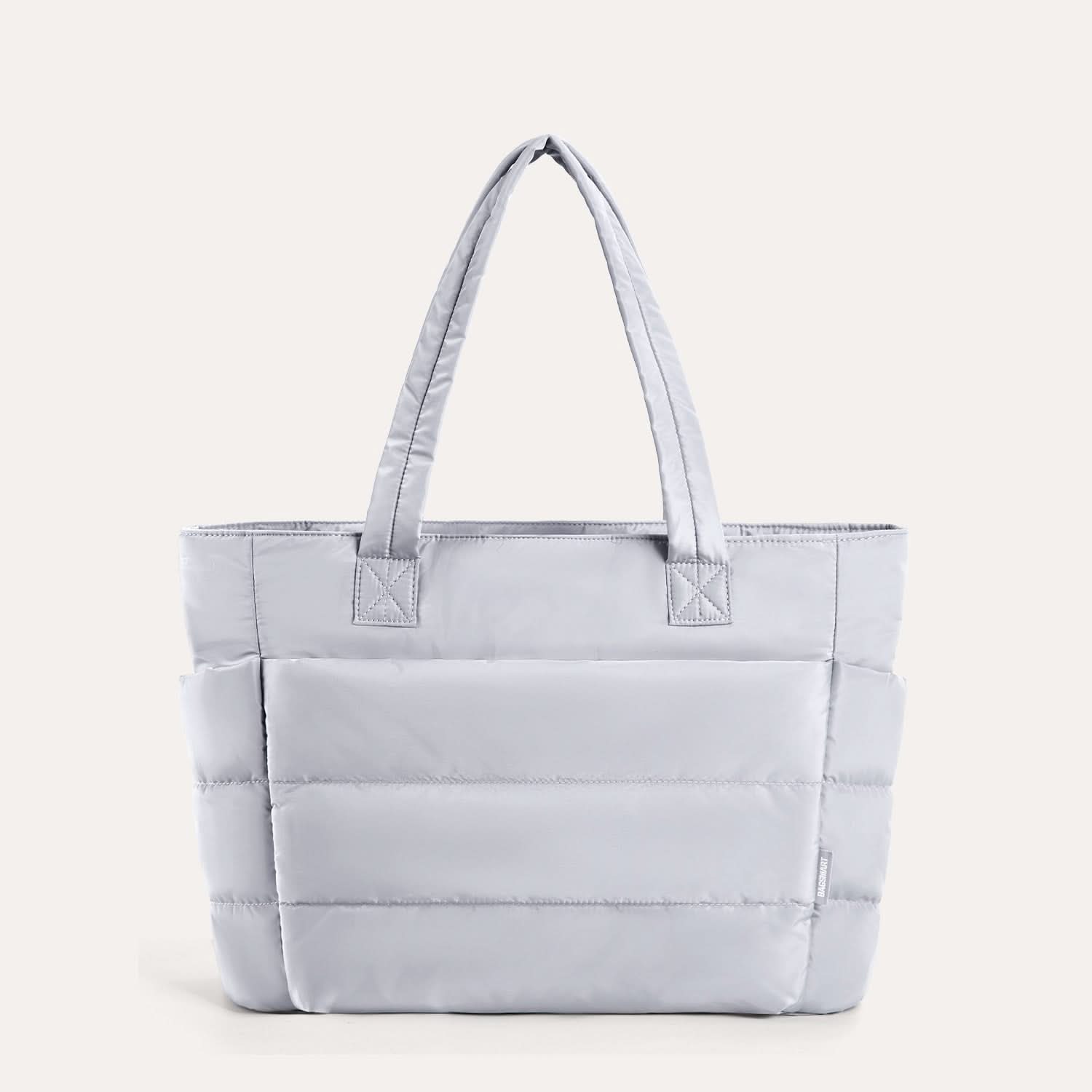 Lavender quilted tote bag with padded design and shoulder straps