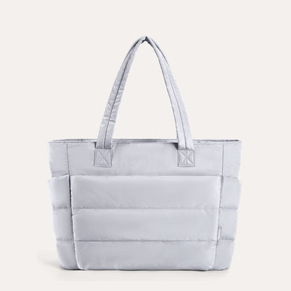 Lavender quilted tote bag with padded design and shoulder straps