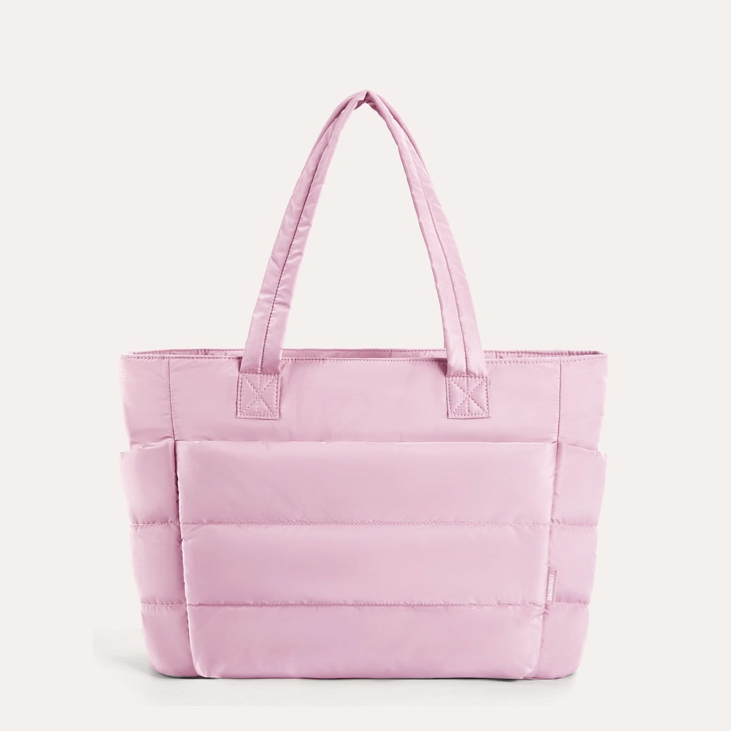 Soft pink quilted laptop tote with structured silhouette