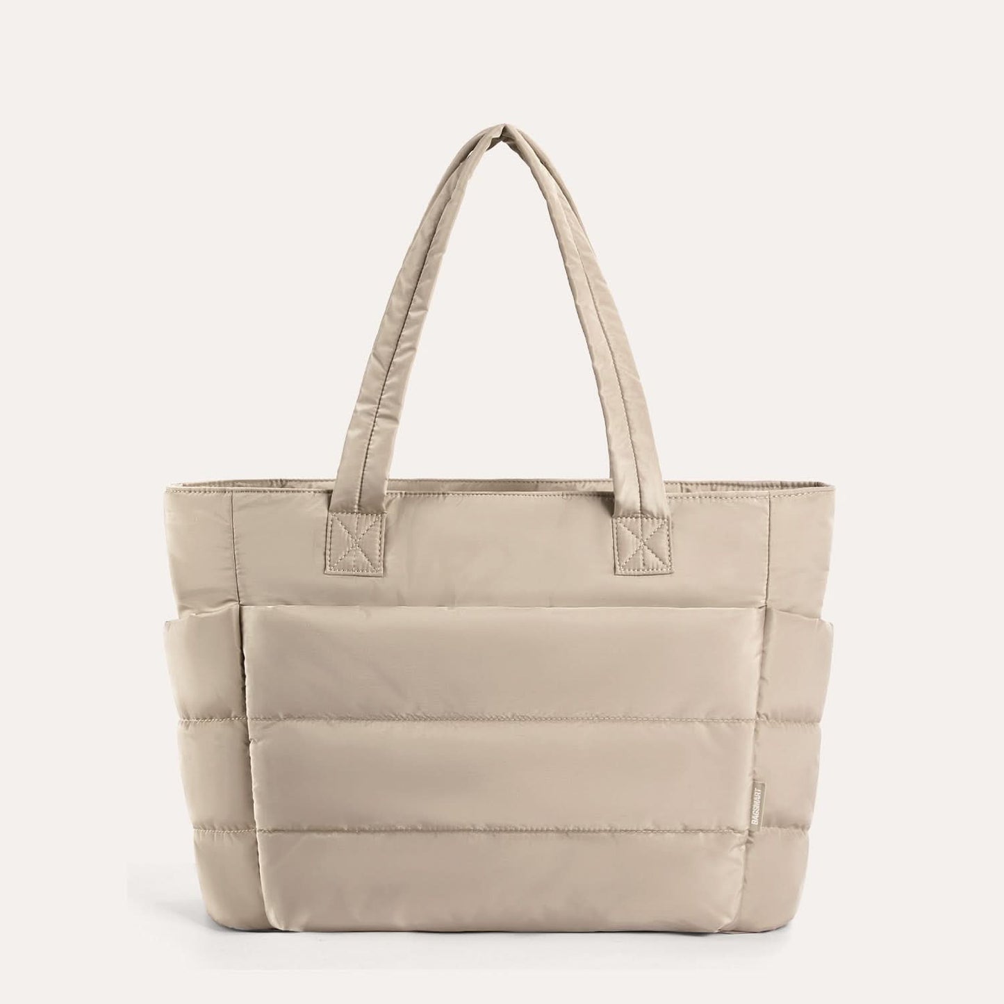 Cream quilted tote bag with horizontal stitch lines and handles