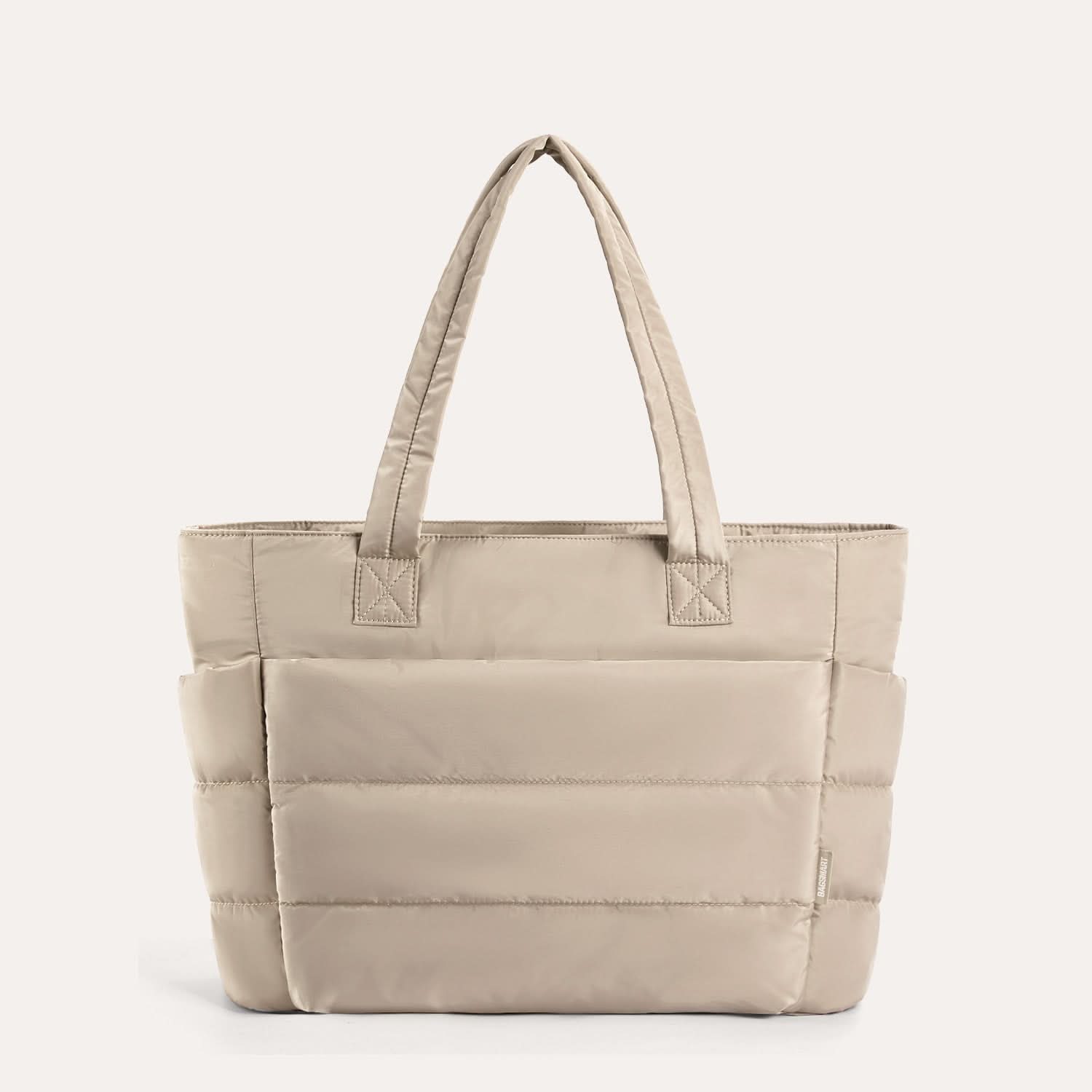 Cream quilted tote bag with horizontal stitch lines and handles