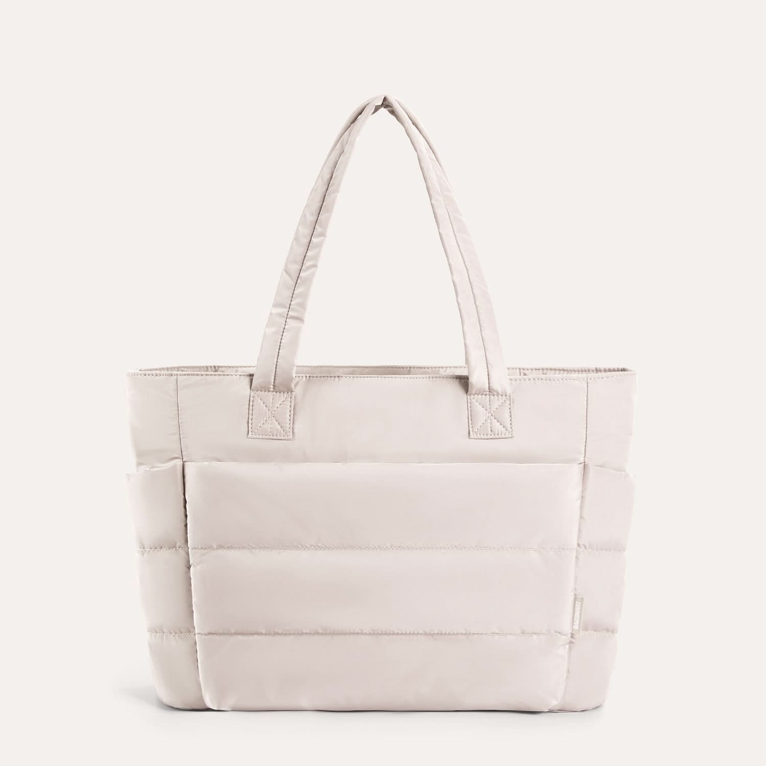 Off-white padded tote with quilted sections and dual handles