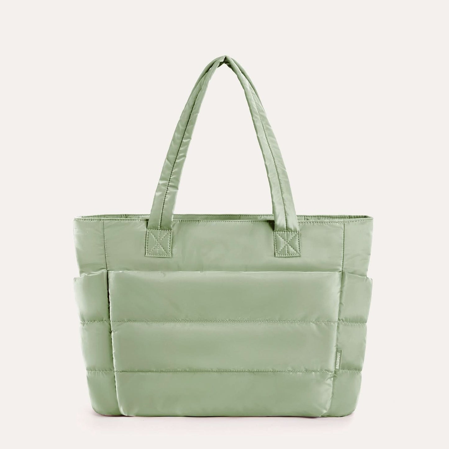 Soft sage green quilted tote with padded compartments