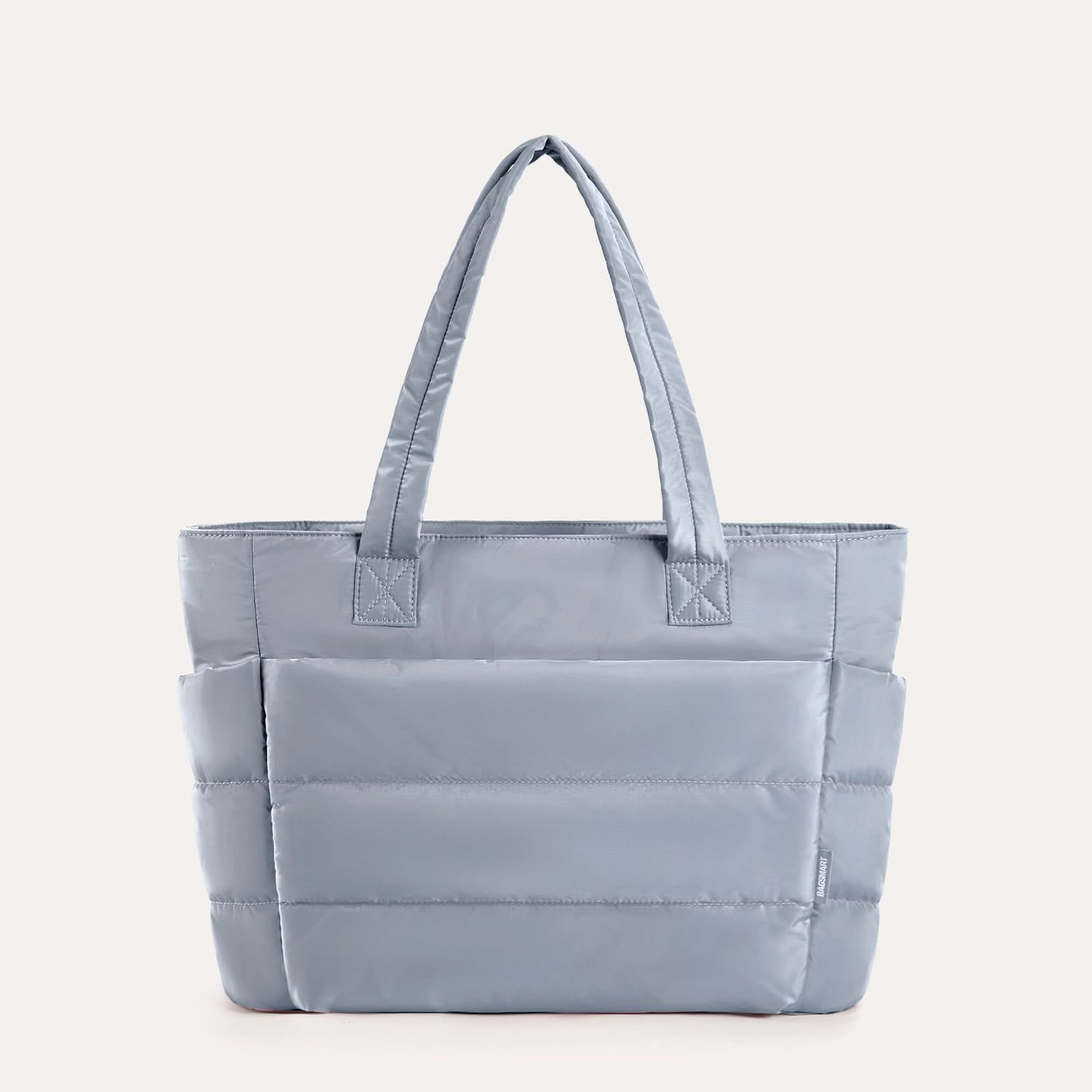Slate blue quilted laptop tote with horizontal padding detail