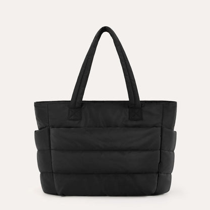 Black quilted city tote with dual handles and padded horizontal sections
