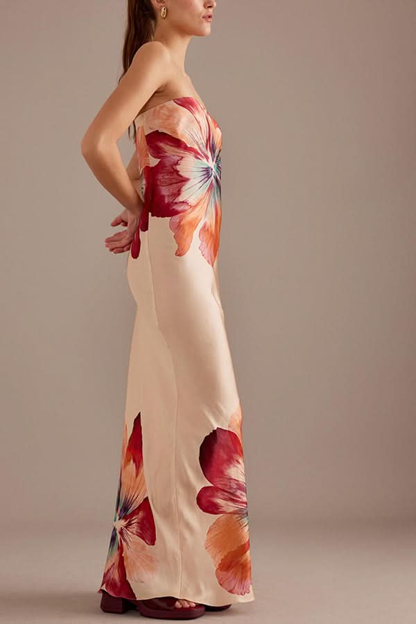 Side view of cream satin maxi dress with large floral blooms in red and coral tones