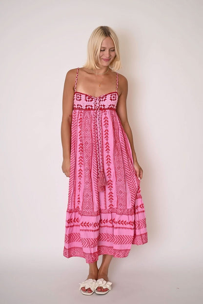 Pink tribal print maxi dress with sweetheart neckline and tiered ruffle hem for women