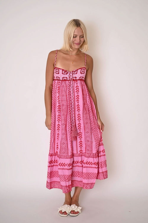 Pink tribal print maxi dress with sweetheart neckline and tiered ruffle hem for women