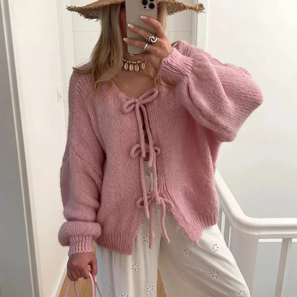 Mauve pink cardigan with puffed sleeves and front bow tie fastening