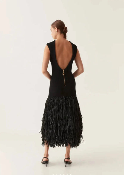 Back view of black midi dress with deep V-back and gold zip closure detail