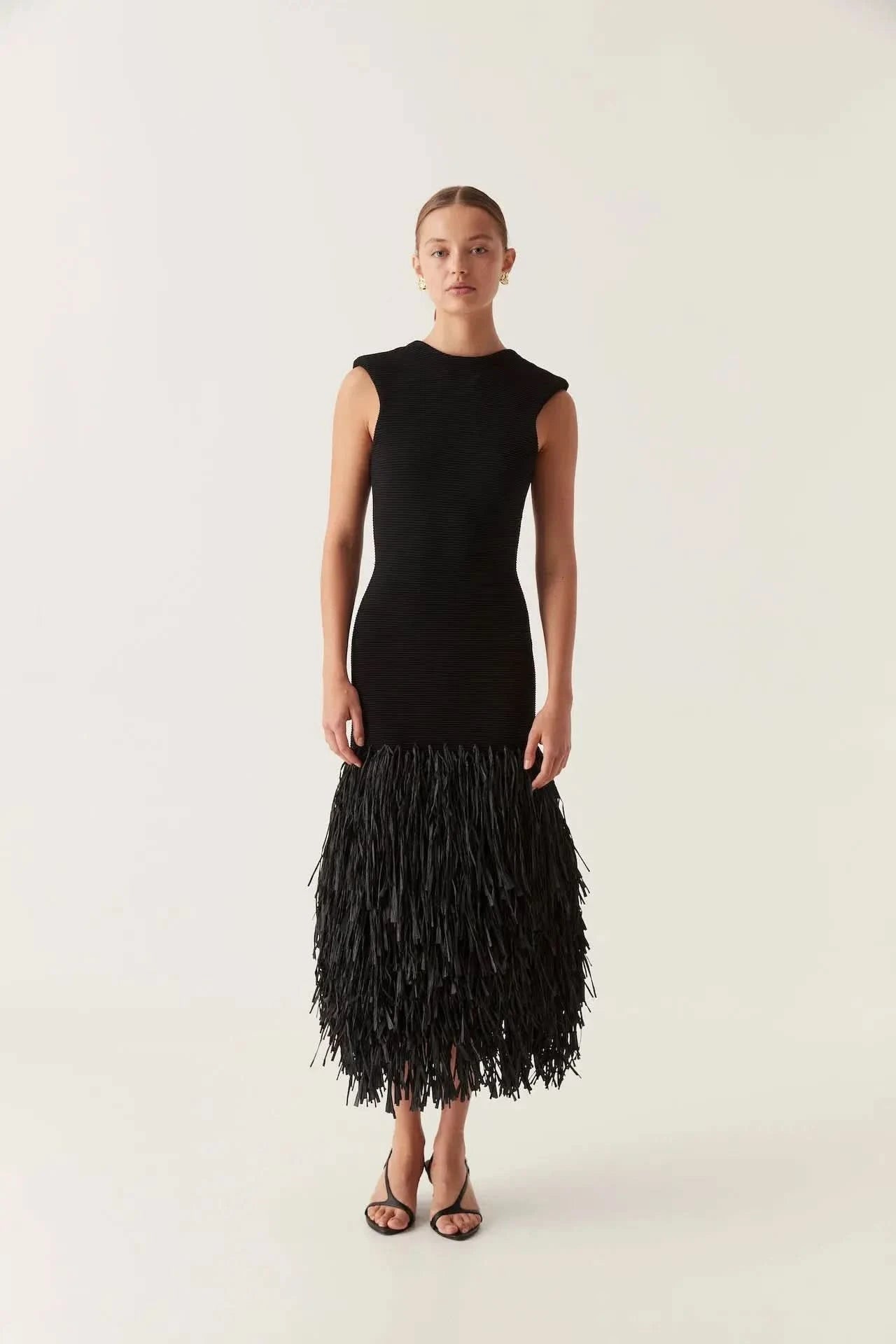 Black knit midi dress with fringe hem and sleeveless crew neck for women