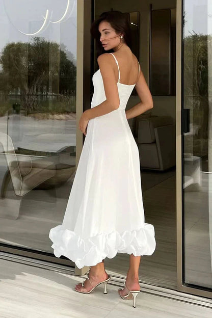 White spaghetti strap midi dress with bubble ruffle hem detail