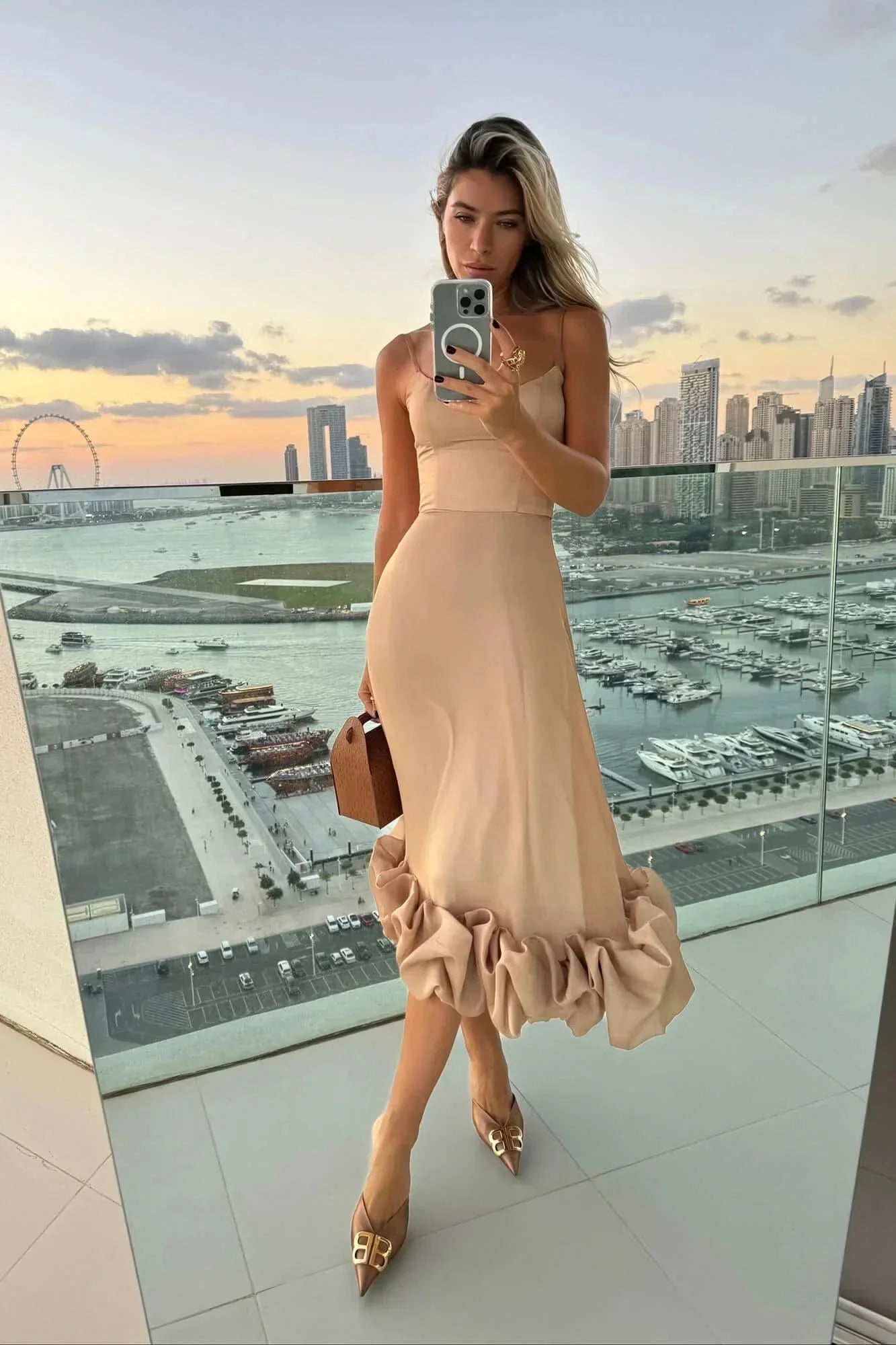 Beige sleeveless midi dress with gathered ruffle bottom hem
