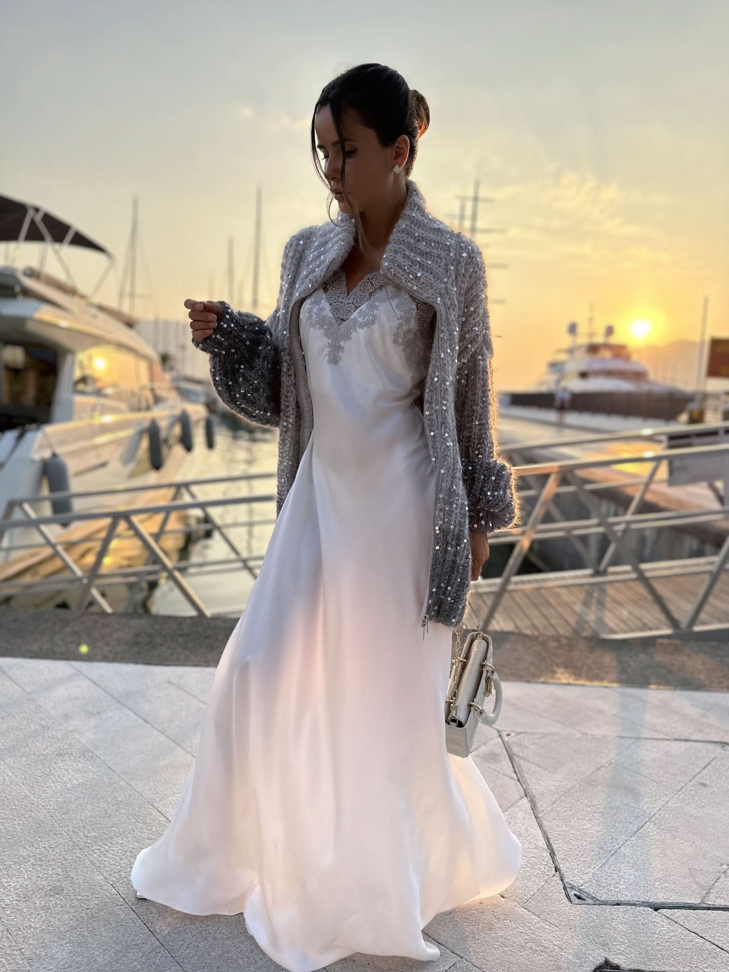 Sparkle cardigan with zip front draped over white flowing gown