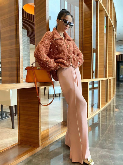 Rust-toned sequin cardigan with relaxed silhouette and zip closure