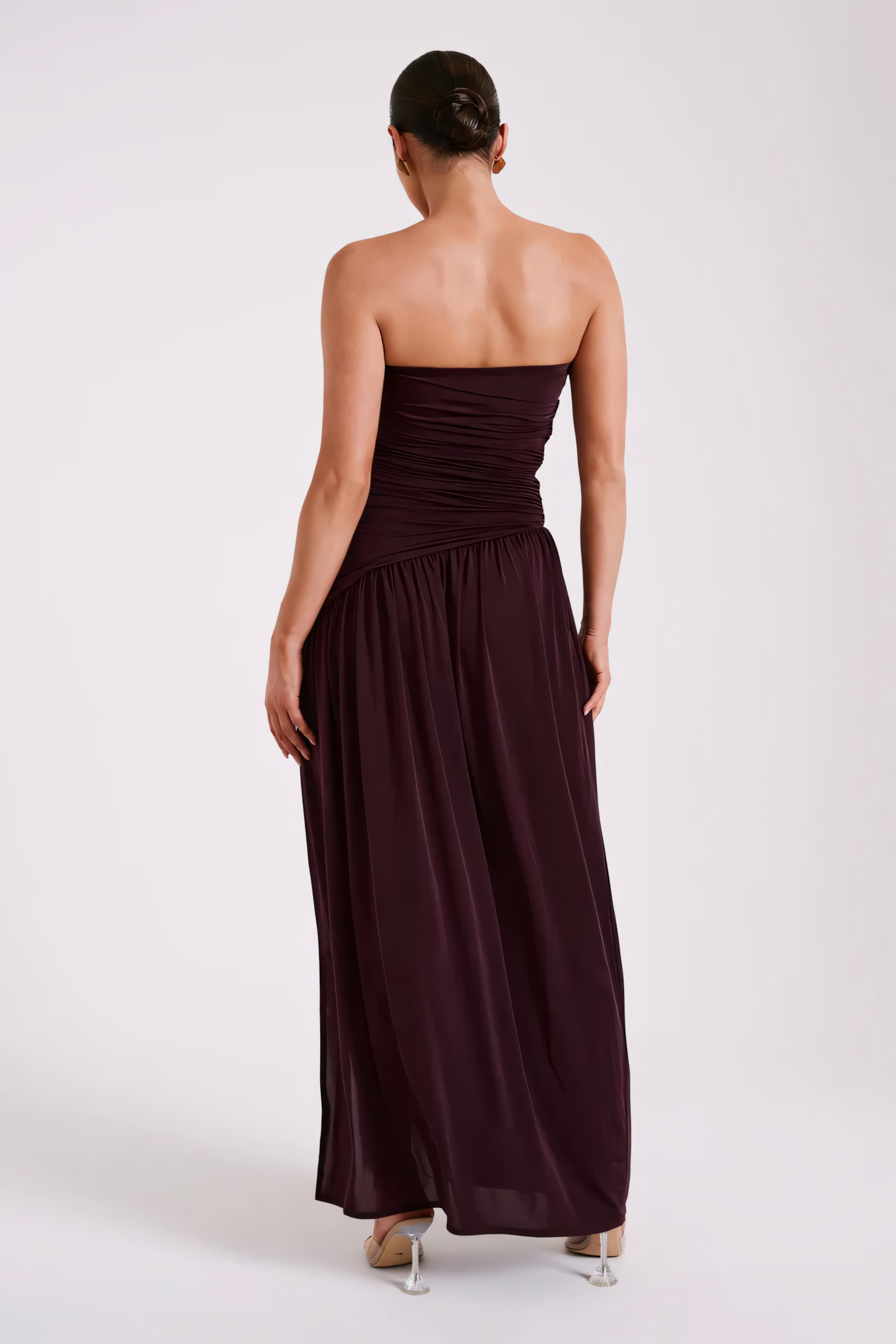 Back view of burgundy strapless maxi dress showing clean back design and flowing skirt