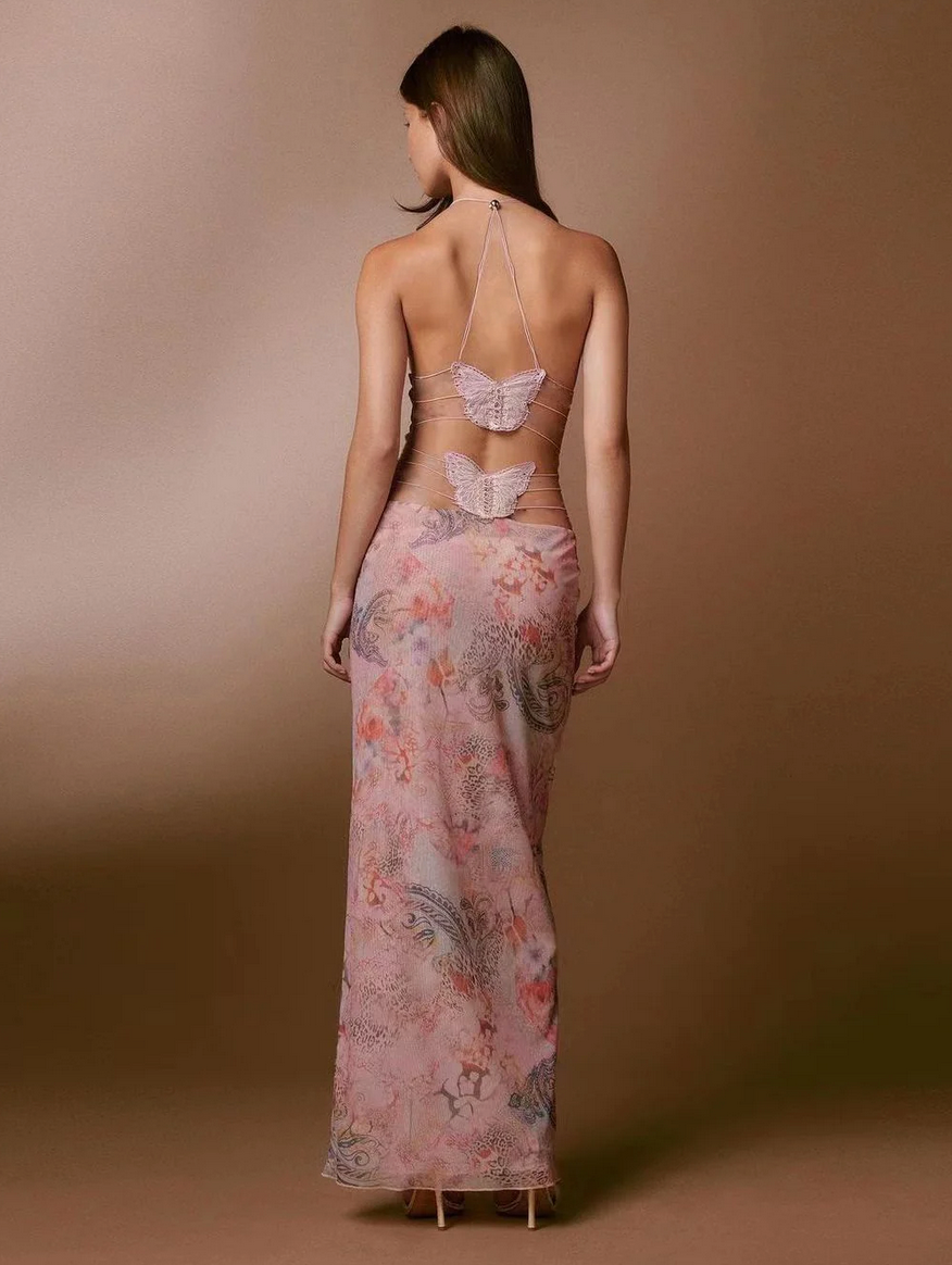 Open strappy back detail of butterfly maxi dress with decorative appliqué for women