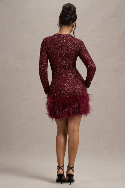 Back view of burgundy sequin mini dress with feathered detail