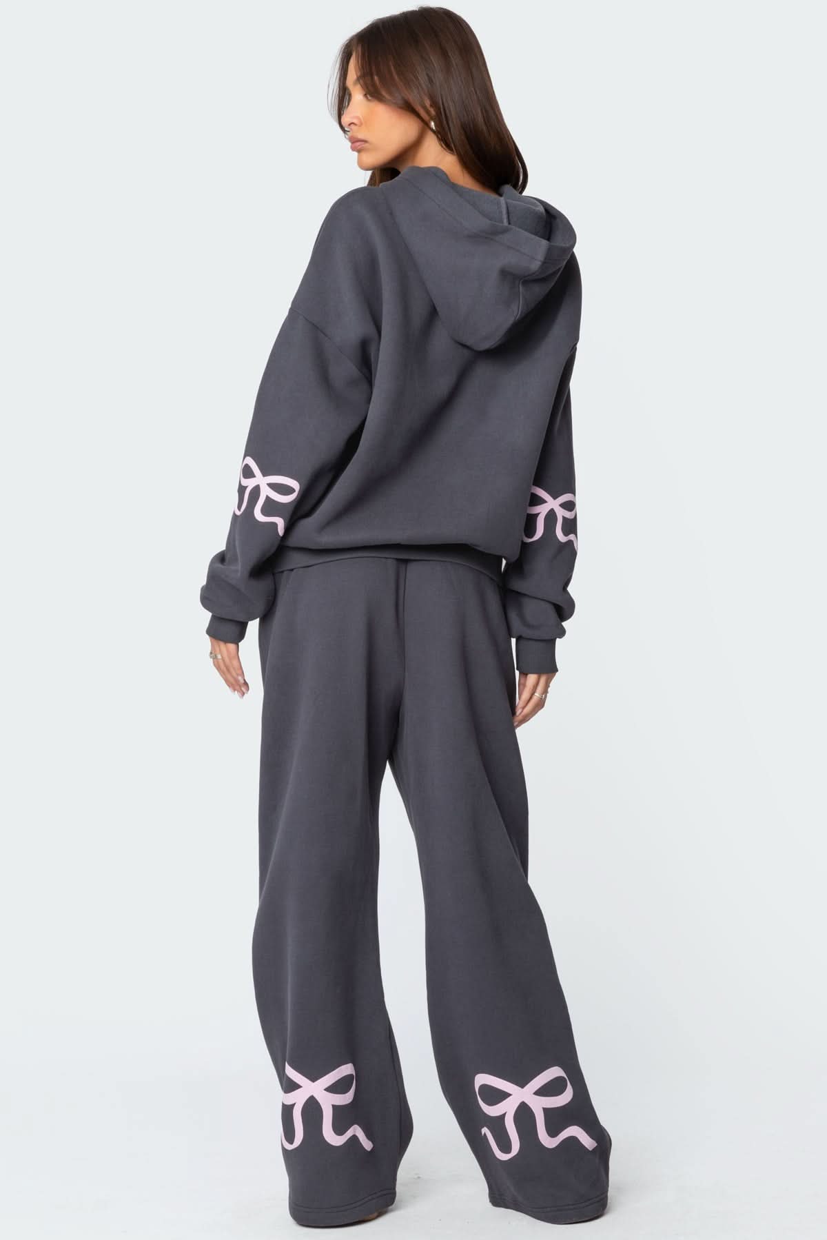 Back view of women's charcoal lounge set showing hoodie and wide-leg pants with bow embroidery