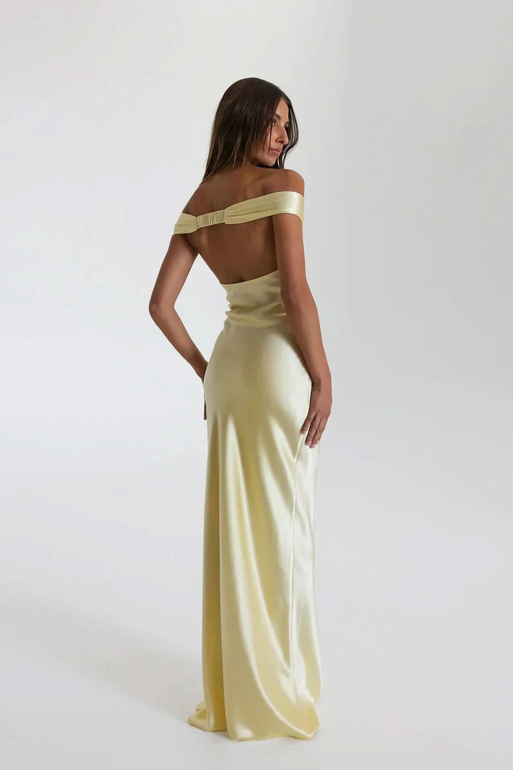 Back view of pale yellow satin maxi dress with open back detail