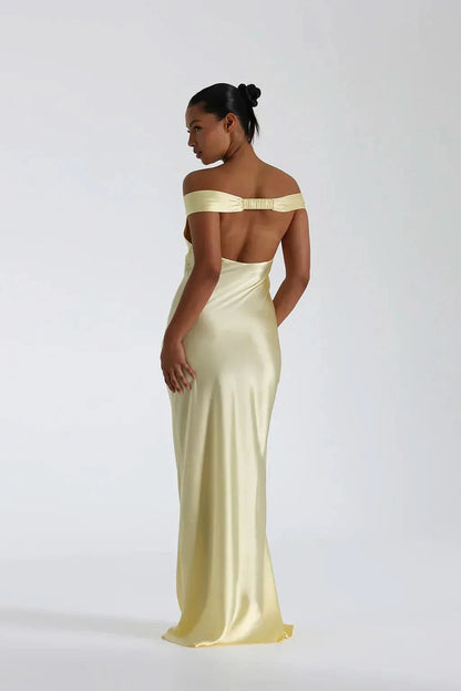 Pale yellow satin maxi dress back view with cutout detail