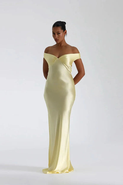 Pale yellow satin off-shoulder maxi gown with draped bodice