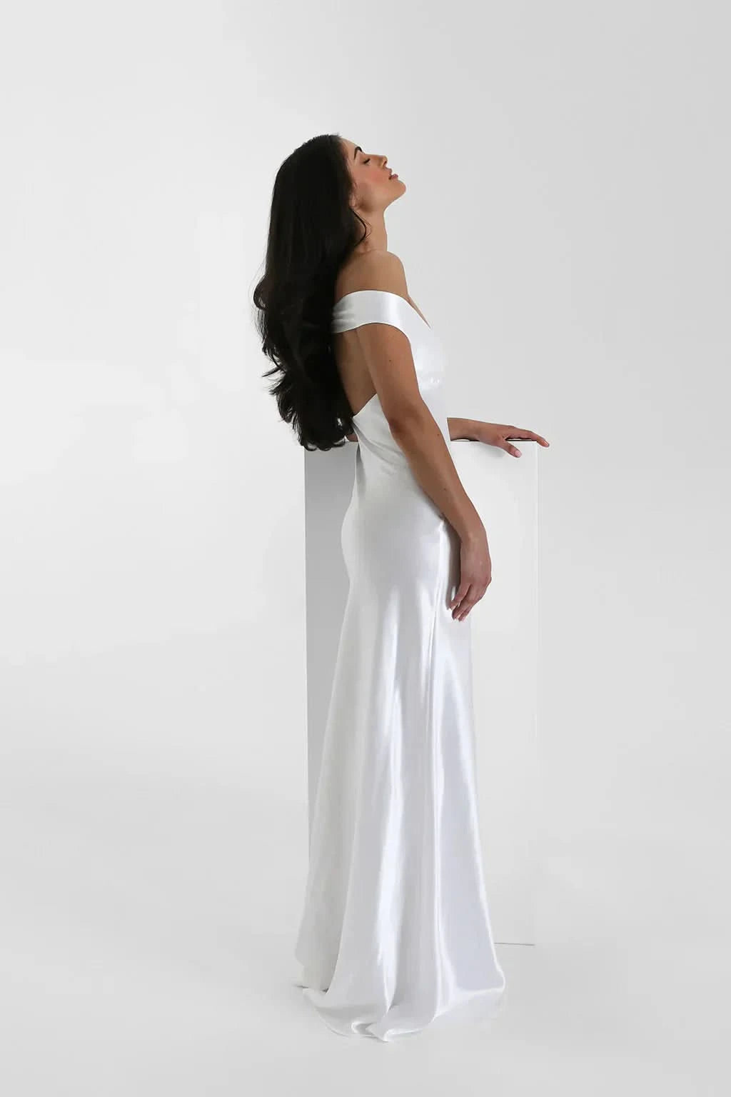 White satin off-shoulder maxi gown side profile view