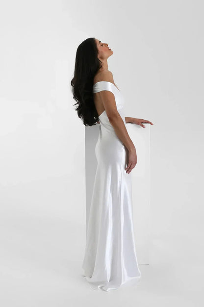 White satin off-shoulder maxi gown side profile view