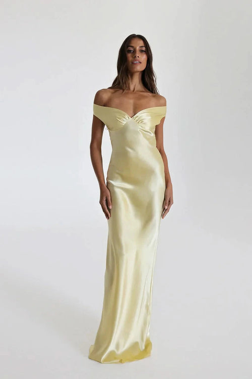 Pale yellow satin off-shoulder maxi gown with draped neckline