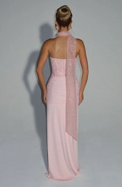 Back view of pink sequin maxi dress with open back and draped shawl detail