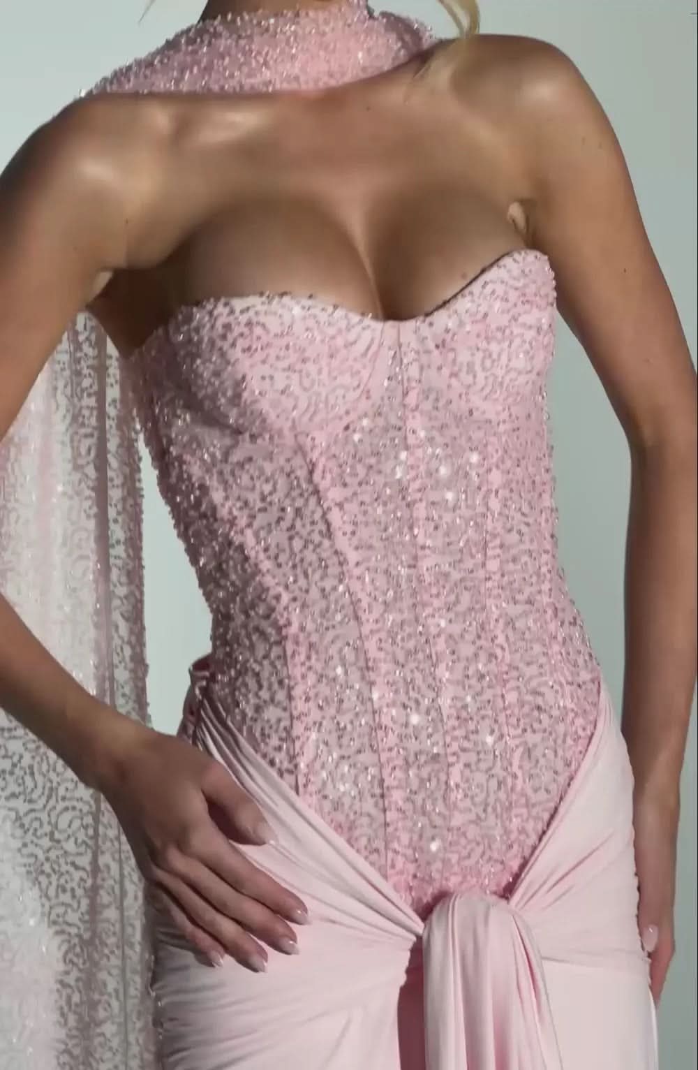 Back view of pink sequin maxi dress with open back and draped shawl detail