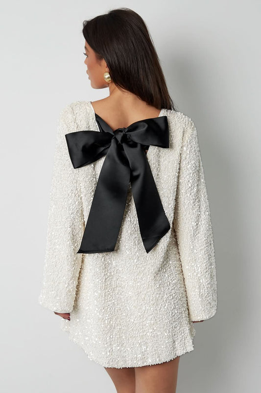 Cream textured mini dress with black back bow detail