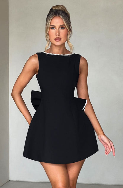 Black A-line mini dress with pearl-trimmed crew neck and structured fit