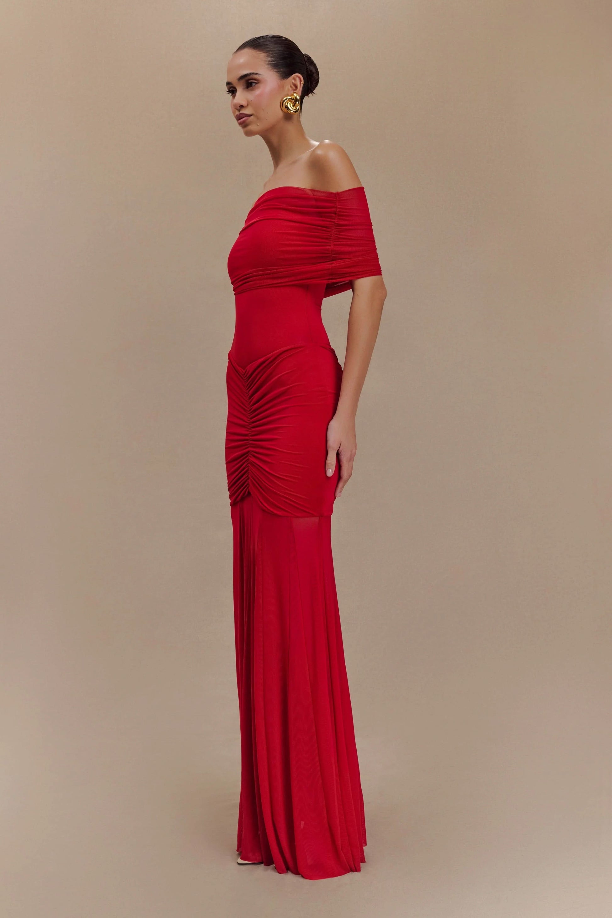 Red ruched off-shoulder maxi dress side profile on model