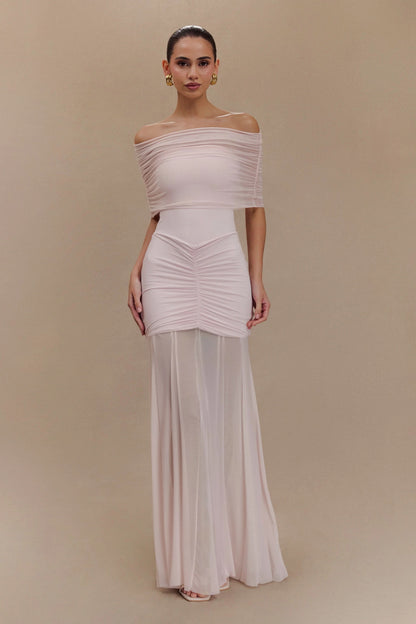 Blush pink off-shoulder maxi dress with gathered bodice and flowing hem
