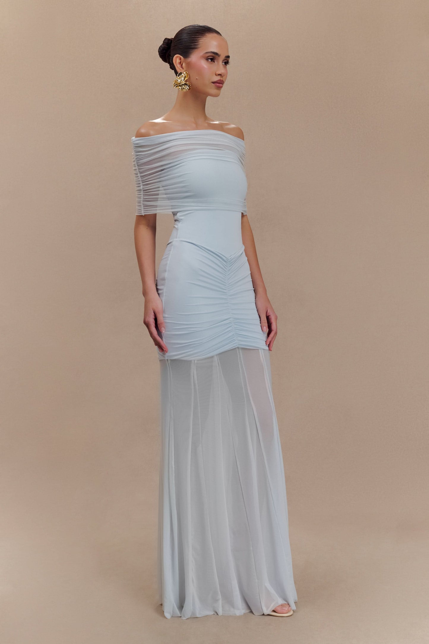 Light blue off-shoulder maxi dress side profile with draped shoulder and maxi length