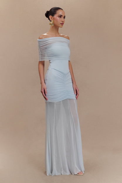 Light blue off-shoulder maxi dress side profile with draped shoulder and maxi length