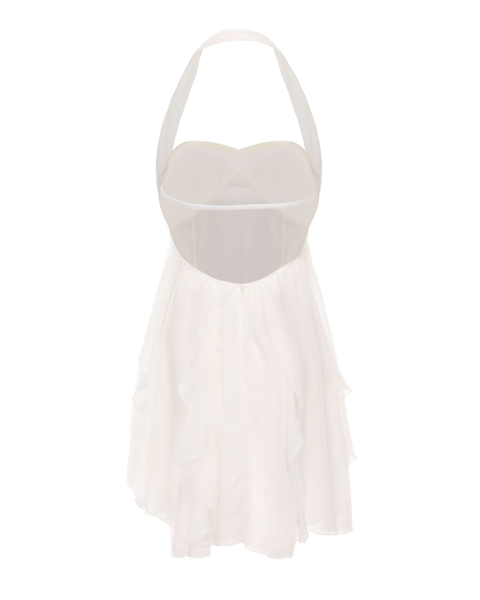 Back view of white halter mini dress showing open back cutout design