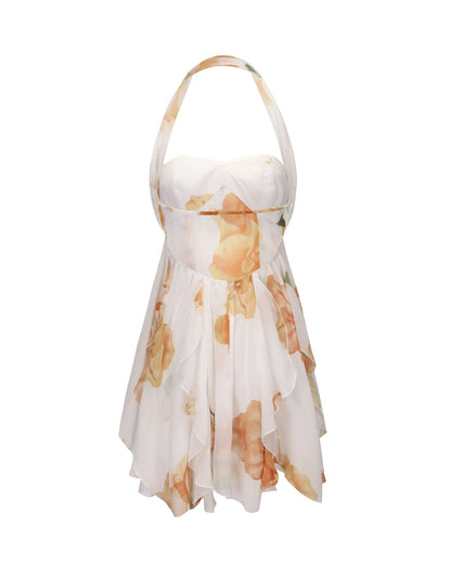 Back view of cream halter mini dress showing cutout and flowing floral layers