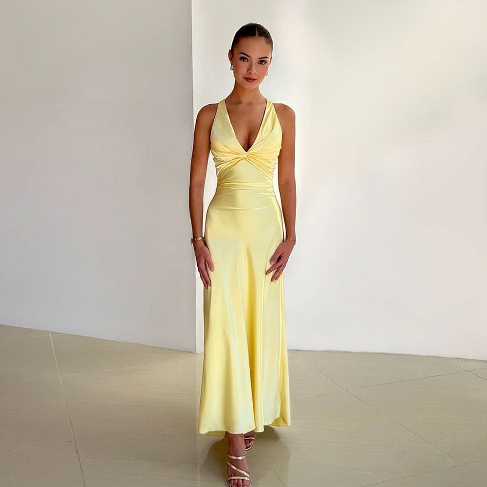 Pale yellow halter maxi dress with twisted front bow detail and fitted bodice